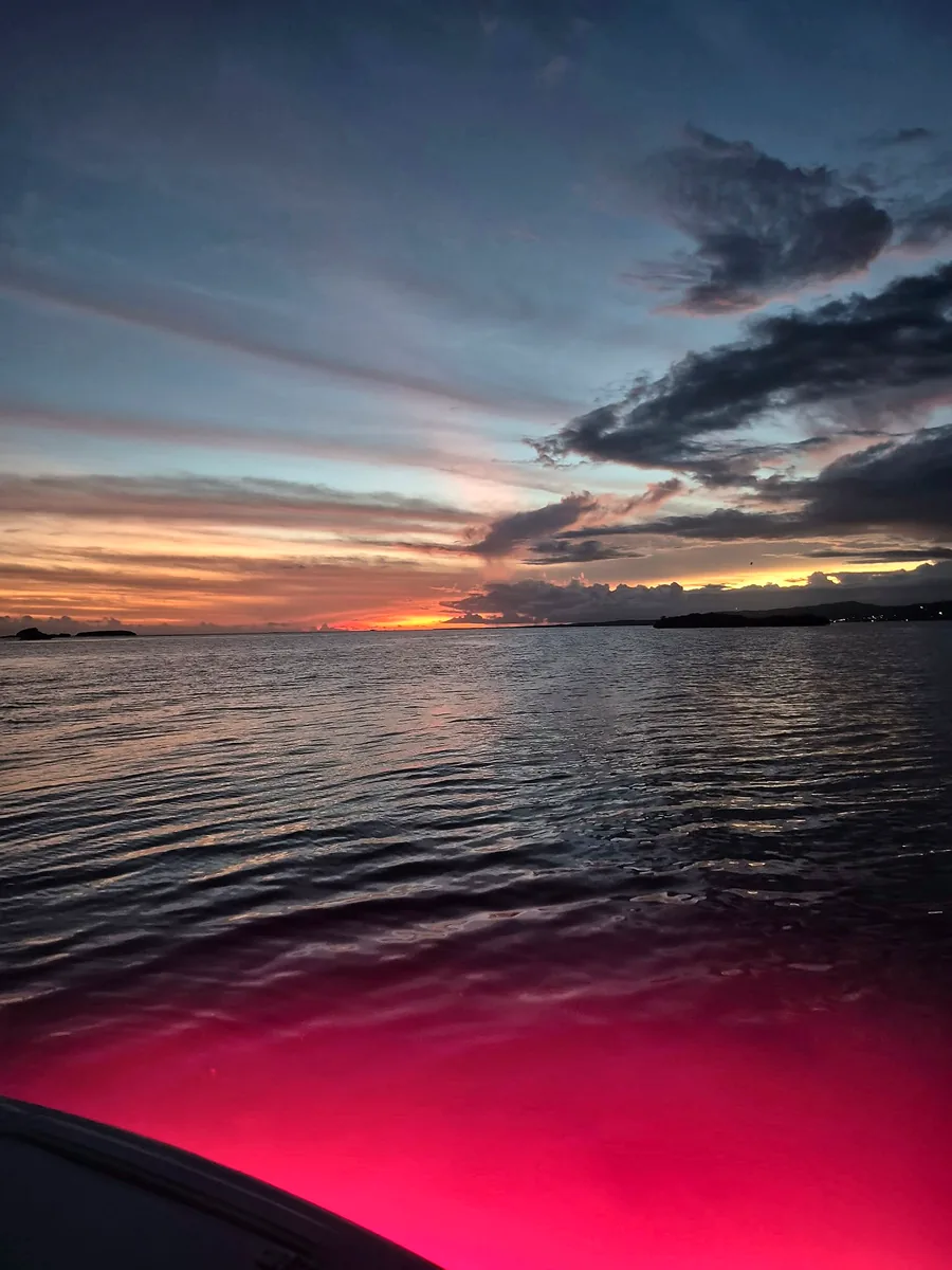 Colorful Caribbean sunset over calm water near Cabo Rojo, Puerto Rico.
