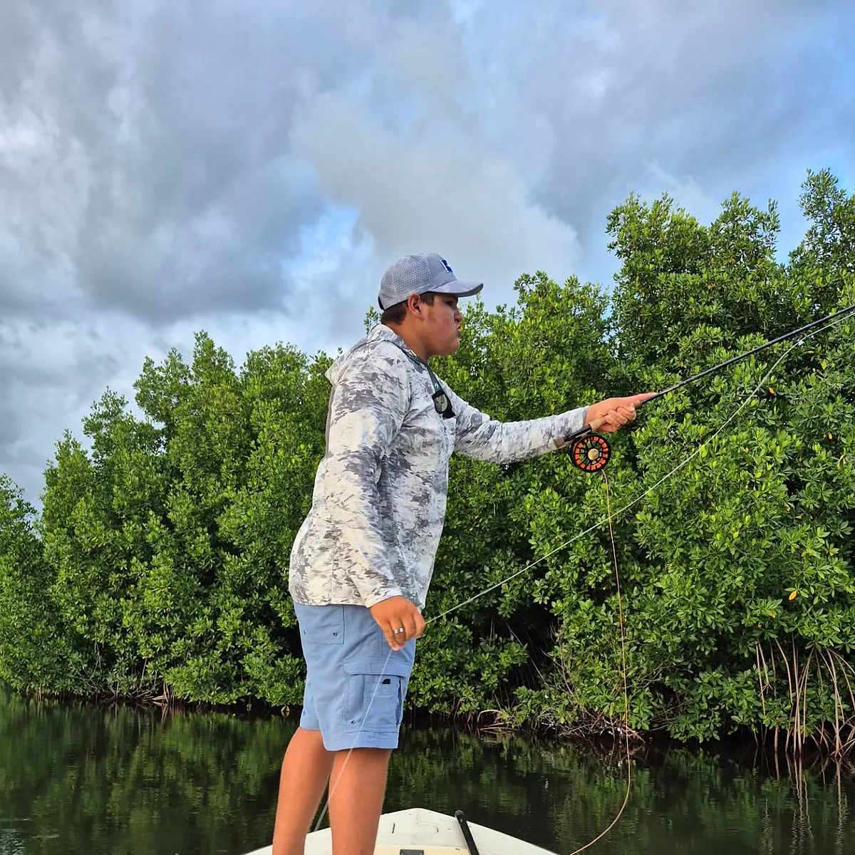 Angler fly casting along mangroves near Cabo Rojo, Puerto Rico.